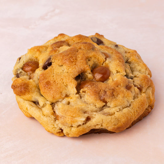 NY Style Caramel Coconut Cookie with golden edges and gooey center