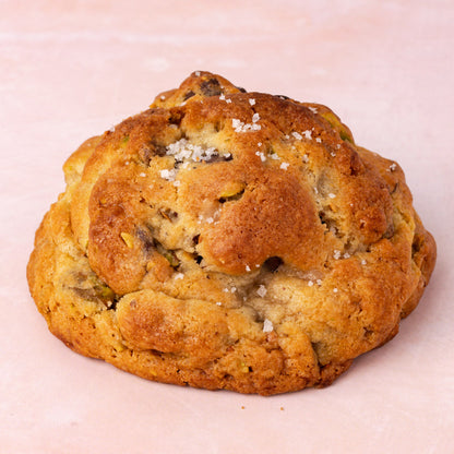 NY Style Pistachio Toffee Cookies with golden edges and gooey