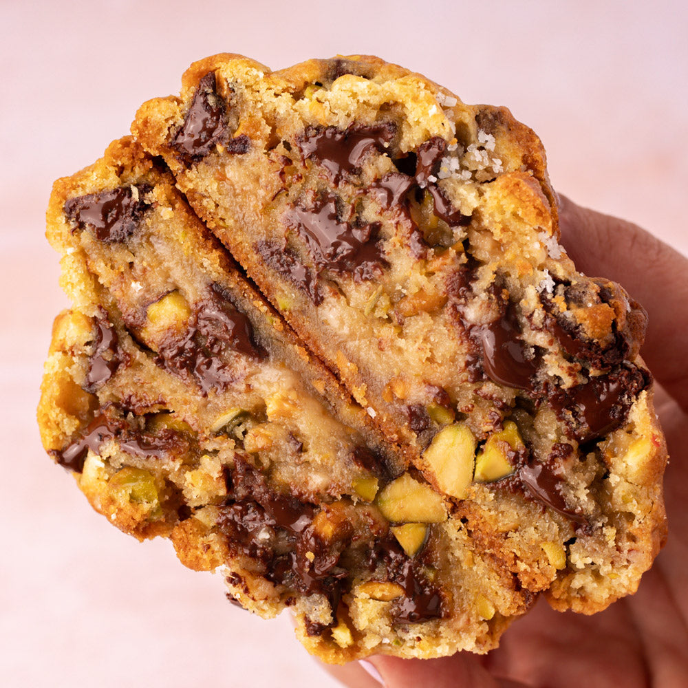 NY Style Pistachio Toffee Cookies with golden edges and gooey