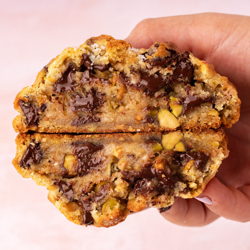 NY Style Pistachio Toffee Cookies with golden edges and gooey