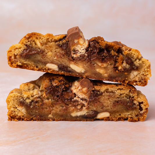 NY Style Snickers Cookie with golden edges and gooey center